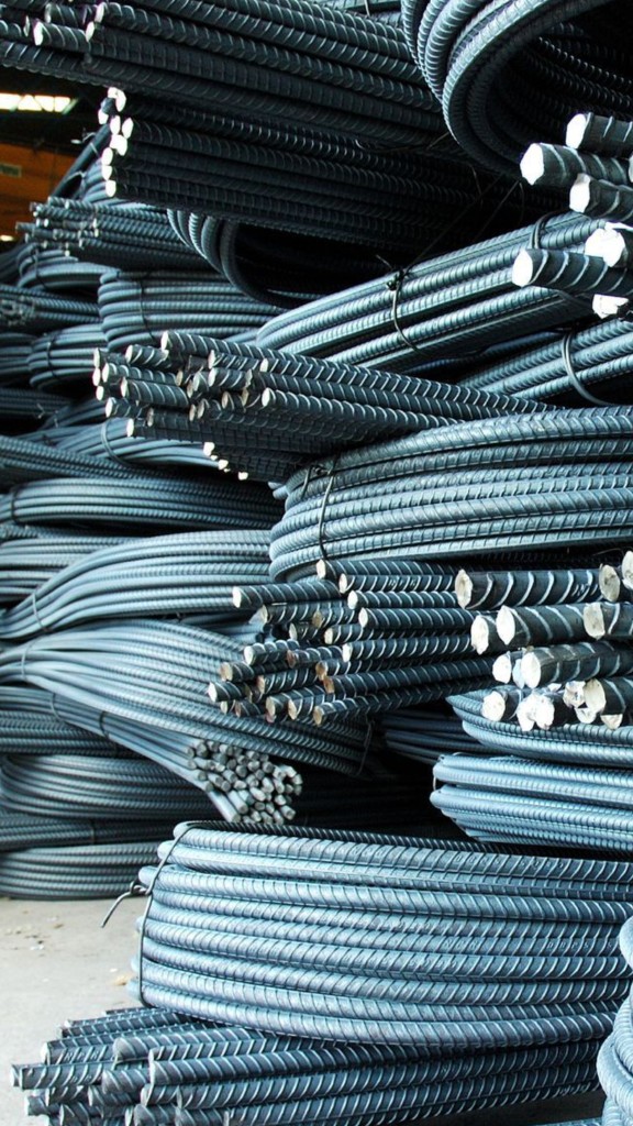 Stacked steel rebar bundles in a wholesale trading warehouse for construction materials inventory